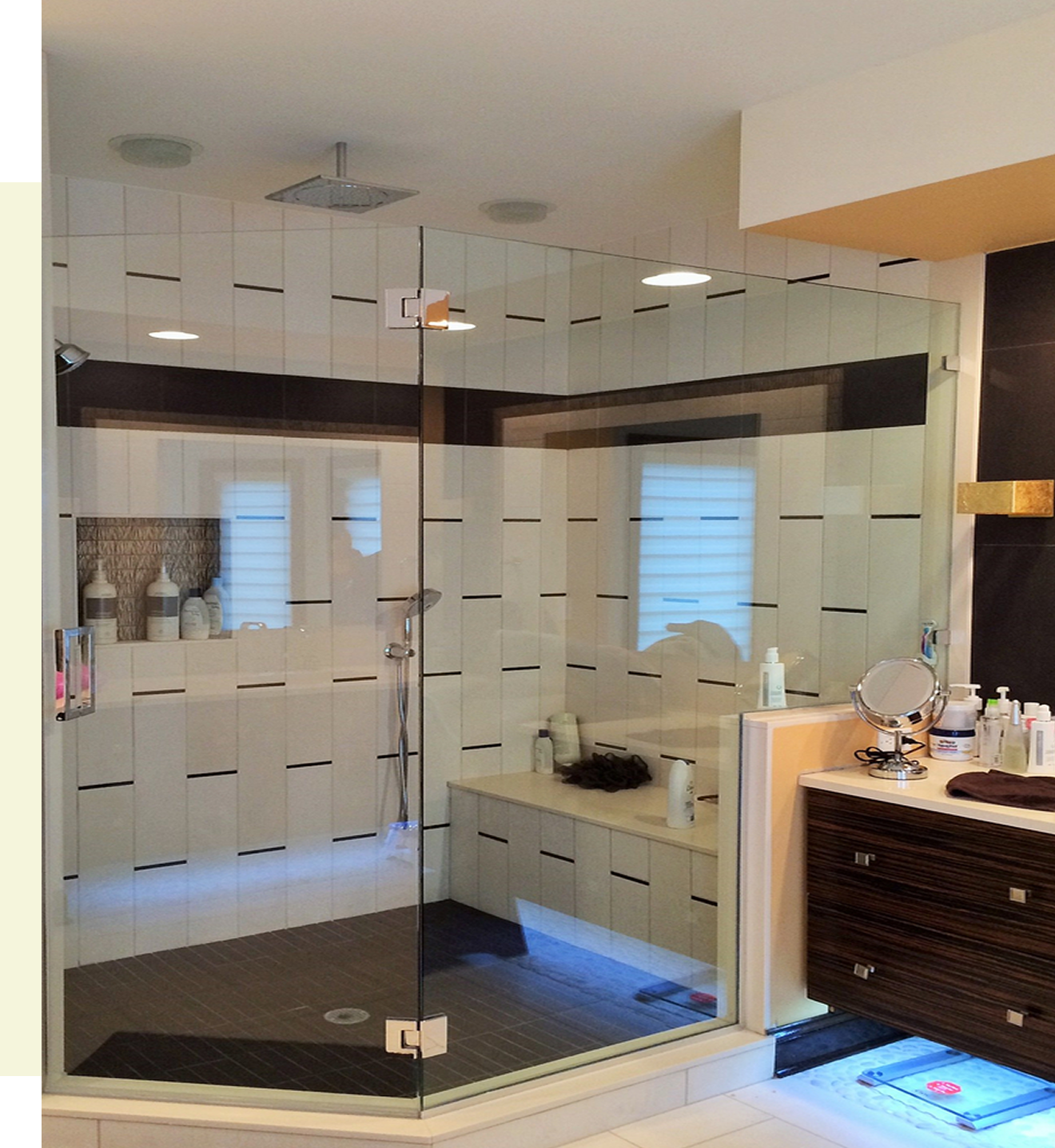 Modern bathroom with glass shower enclosure.